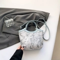 Light blue embroidered silk bucket bag with floral patterns and round handles - Blue
