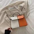 Classic Kelly style handbag in orange and white two-tone leather with gold clasp - White