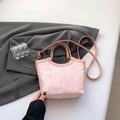 Pink silk jacquard handbag with floral texture, top handle, and adjustable shoulder strap - Pink
