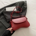Retro red leather crescent shoulder bag with golden lettering and knot strap detail - Red