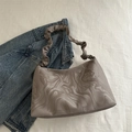 Chic taupe pleated cloud bag with marble ink pattern on soft faux leather finish - Gray