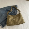Dark olive green marble pattern pleated shoulder bag placed on a textured white surface - Green