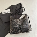 Leopard print hobo bag with black leather butterfly patchwork and lace-up detail - Black