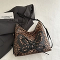 Leopard print tote bag with black butterfly patch and lace-up details on adjustable strap - Brown