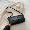 Chic black crescent underarm bag with silver buckle in minimalist vegan leather - Black
