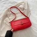 Minimalist red leather crescent shoulder bag with stylish silver metal buckle detail - Red