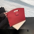 Minimalist deep red litchi grain leather handbag with cutout handle and silver snap - Red