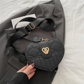Chic black heart-shaped quilted crossbody bag with golden hardware and wide strap - Black