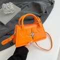 Minimalist bright orange crossbody handbag with silver star buckle for casual wear - Orange