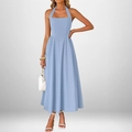 Detail of light blue halter neck dress showing elegant backless design and A-line silhouette - Blue