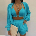 Detail of cyan three-piece beach set featuring pleated fabric texture and loose shirt - Blue
