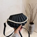 Chic black shell-shaped crossbody bag with pearl chain and quilted faux leather finish - Black