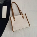 White faux-crocodile tote bag with brown contrast trim and elegant gold studs - White