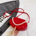 Red shell-shaped crossbody bag featuring elegant pearl handle and leather texture - Red