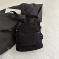 Mini mochila de pana negra con correas ajustables y bolsillo frontal para uso casual - Negro