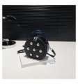 Détail d'un petit sac rond noir à rivets argentés dans un décor moderne et minimaliste - Noir
