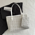 White tweed tote bag set with golden stitching and matching zipper pouch in minimalist style - White