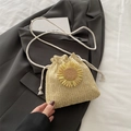 Beige woven bucket bag featuring yellow sunflower detail and white cotton rope strap - Khaki With Yellow