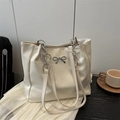 Elegant beige leather tote bag with silver bow accent and chain shoulder strap - No Pendant / White