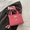 Pink lychee texture crossbody bag with metal deer pendant for women in casual style - Rose Pink
