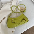 Chic avocado green shoulder bag with gold buckles on a minimalist aesthetic background - Green