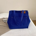 Dark blue canvas tote bag with contrast stitching and large front pocket for daily commute - Blue