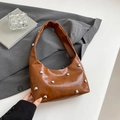 Brown faux leather crescent bag with silver stud details and a wide shoulder strap - Brown
