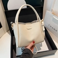 Chic off-white lychee texture bucket bag with top handle and adjustable strap - No Pendant / White