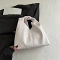 Minimalist white woven leather underarm bag with a stylish knot handle and texture - White