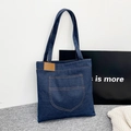 Large capacity navy blue denim tote bag with leather label for daily commute - Front Pocket Patch Style (Style One) / Dark Blue