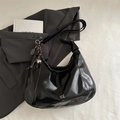 Black glossy patent leather crescent shoulder bag with unique tennis racket pendant - Black (With Charm)