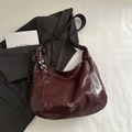 Deep burgundy glossy crescent tote bag with letter print and decorative keychain - Red (With Charm)