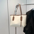 Minimalist cream tote bag with dark brown straps for college and commuting usage - Off White