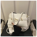 Detail of white shell handbag with golden metal buckle and black lining on leather - White