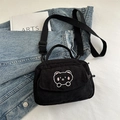 Black corduroy crossbody bag featuring a cute cartoon bear embroidery and dual zippers - Black