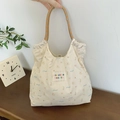 Cremefarbene Canvas-Einkaufstasche mit Tiermustern und orangefarbenen Griffen - Beige Schleifenbär-Stil