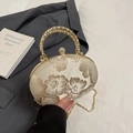 Elegant ivory round evening clutch bag featuring floral embroidery and gold braided handle - White