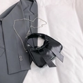 Bolso cubo negro brillante de cuero PU con lazo grande y correa de cadena - Negro
