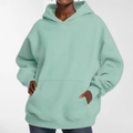 Macro detail of mint green oversized hoodie featuring loose knit fabric and kangaroo pocket - Blue-Grey / M