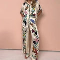 Elegant off-white two-piece set featuring short-sleeve printed shirt and wide-leg trousers - Apricot