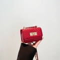 Red quilted leather mini crossbody bag with gold chain strap and metal clasp - Red