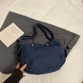 Dark blue denim crossbody bag with curved tote design and metal snap closure - Dark Blue