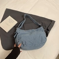 Light blue denim crossbody bag with silver rivets and wide shoulder strap - Light Blue