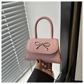 Detail of light pink mini bag with silver metal bow and delicate chain strap - Pink