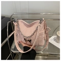 Close-up of pink pleated shoulder bag with silver butterfly buckle and chunky chain - Pink