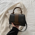 Mini retro shoulder bag in dark grey and brown leather, shown in a lifestyle flat lay - Black