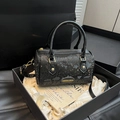 Elegant black snakeskin textured pillow handbag with gold accents and crossbody strap - Black (Without Charm)