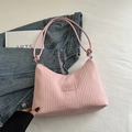 Pink pleated bucket bag with long strap and minimalist brand patch detail - Pink