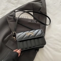 Elegant black quilted square crossbody bag with golden metal bow buckle and strap - Black