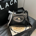Minimalist black leather tote bag with gold twist lock and white lace bow detail - Black